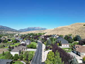 View of mountain backdrop with nearby suburban area