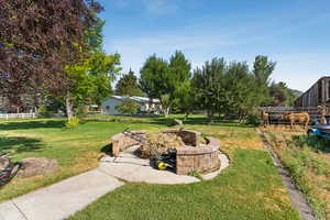 View of yard with an outdoor fire pit