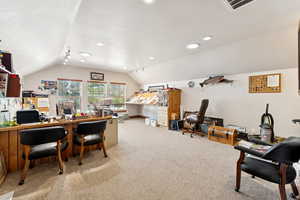 Office space featuring lofted ceiling, carpet floors, and recessed lighting