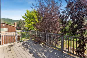 Wooden terrace featuring a mountain view