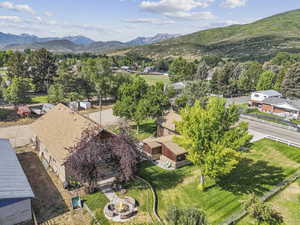 View of subject property featuring a mountainous background