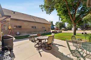 View of patio with outdoor dining space