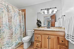 Bathroom featuring vanity and a shower with curtain