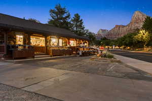 View of property featuring uncovered parking