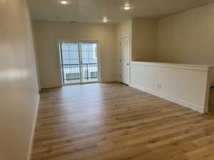 Unfurnished room featuring light wood-style floors and recessed lighting