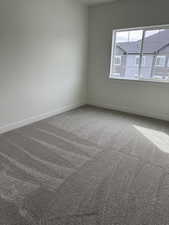 Empty room with carpet floors