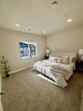 Carpeted bedroom featuring recessed lighting