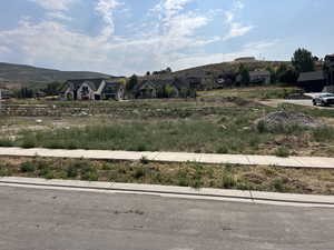 View of yard featuring a residential view and a mountain view
