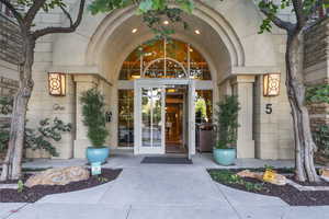 View of exterior entry featuring stone siding