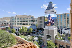 View of building exterior with a city view and a mountain view