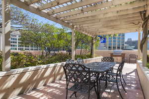 View of patio / terrace with a pergola, outdoor dining space, and area for grilling