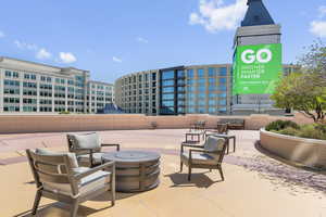 View of patio featuring an outdoor living space with a fire pit