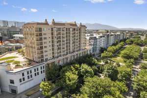 View of property featuring a mountain view and a view of city