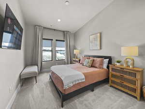 Carpeted bedroom with baseboards and recessed lighting