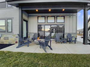 View of patio featuring a fire pit