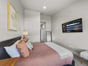 Bedroom featuring recessed lighting and baseboards