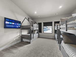 Unfurnished bedroom with carpet and recessed lighting