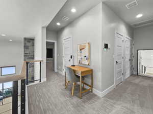 Corridor featuring carpet, recessed lighting, an upstairs landing, and an office area