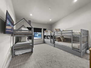 Carpeted bedroom with recessed lighting and baseboards