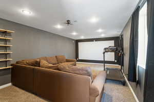 Cinema room featuring light colored carpet and recessed lighting