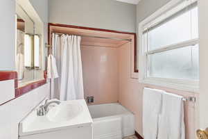 Bathroom with vanity and shower / bath combo