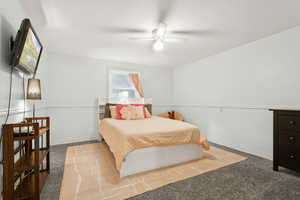 Bedroom featuring carpet and ceiling fan