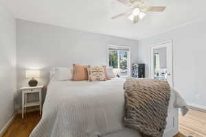 Bedroom featuring wood finished floors and ceiling fan