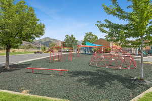 Community jungle gym featuring a mountain view