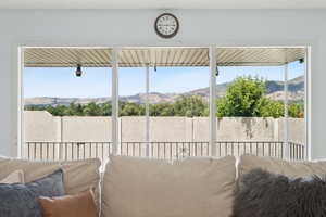 Sunroom featuring a mountain view