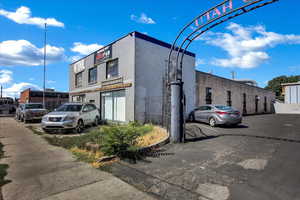 View of property featuring uncovered parking