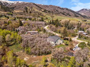 Aerial view of property and surrounding area with mountains