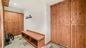 Mudroom with stone finish flooring and recessed lighting