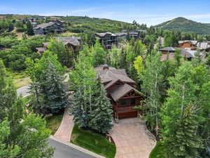 Aerial perspective of suburban area featuring a mountain backdrop