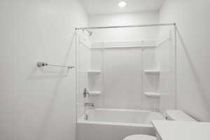 Full bath with washtub / shower combination and vanity