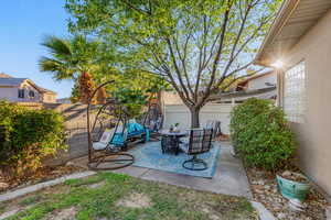 Fenced backyard featuring a patio