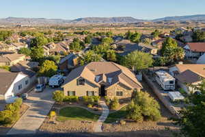 Aerial perspective of suburban area with a mountainous background