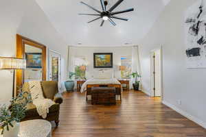 Bedroom featuring hardwood / wood-style flooring, access to outside, ceiling fan, and high vaulted ceiling
