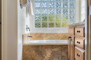 Bathroom with a relaxing tiled tub