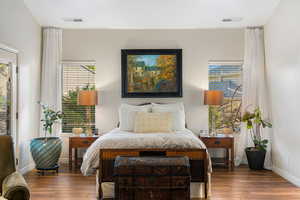 Bedroom featuring wood-type flooring and access to exterior