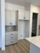 Kitchen featuring Quartz countertops, LVP flooring - Completion est. for Sept 2025