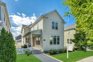 Traditional-style house with covered porch