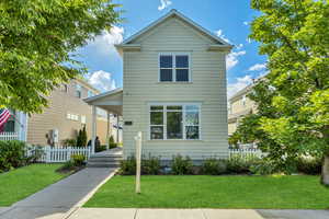 Traditional-style home featuring covered porch