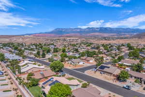Aerial perspective of suburban area featuring a mountainous background