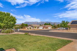 View of asphalt road with a mountain view and traffic signs