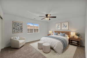 Carpeted bedroom with baseboards and ceiling fan