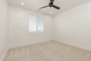 Unfurnished room with light colored carpet, recessed lighting, and a ceiling fan