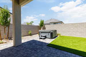 Fenced backyard featuring a patio area