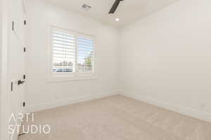 Empty room featuring carpet floors, a ceiling fan, and recessed lighting