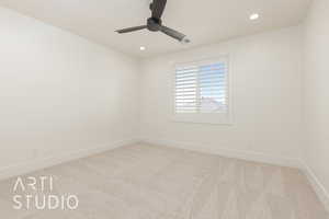Spare room with carpet, a ceiling fan, and recessed lighting