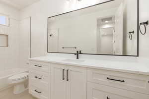 Bathroom with vanity and  shower combination